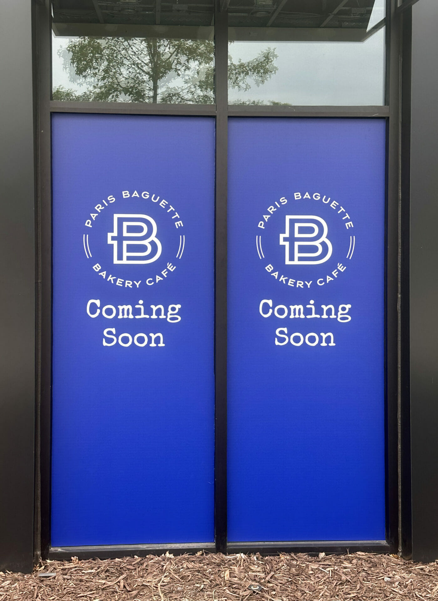 Coming soon door wraps with branding