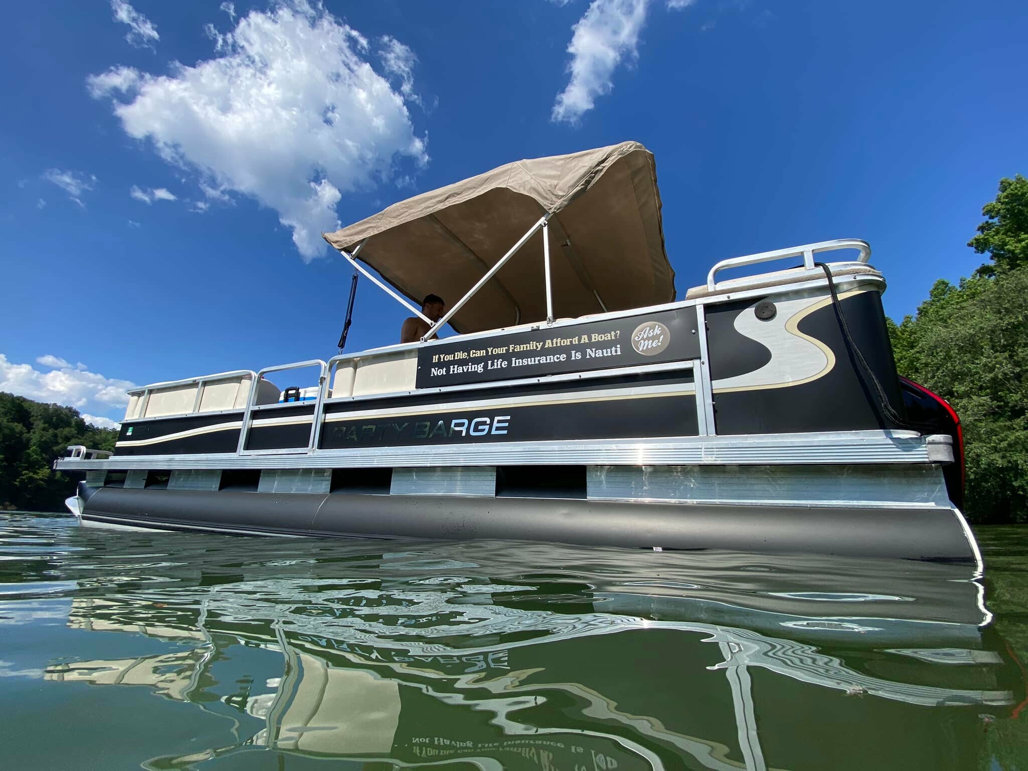 Pontoon boat with advertising wrap